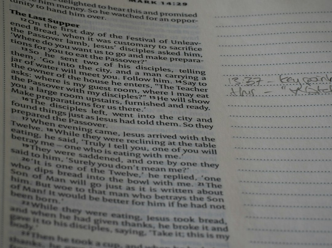 Fictional case file folder with photographs, a map and handwritten notes on a table